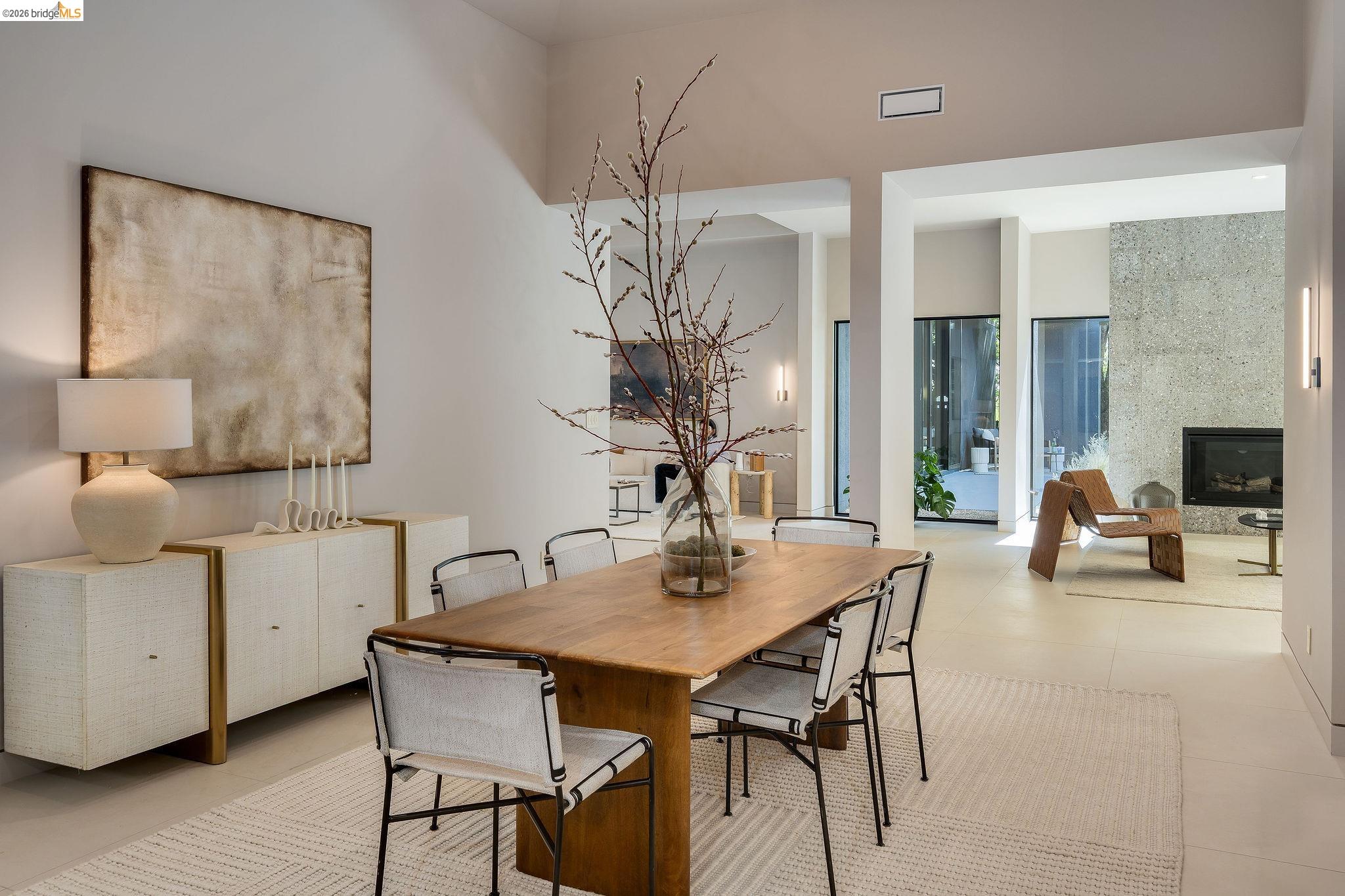 5645 Bacon Road Oakland, CA 94619 - Photo 24 of 94 Open-concept living space with a dining area featuring a light wood-finish table and sleek chairs