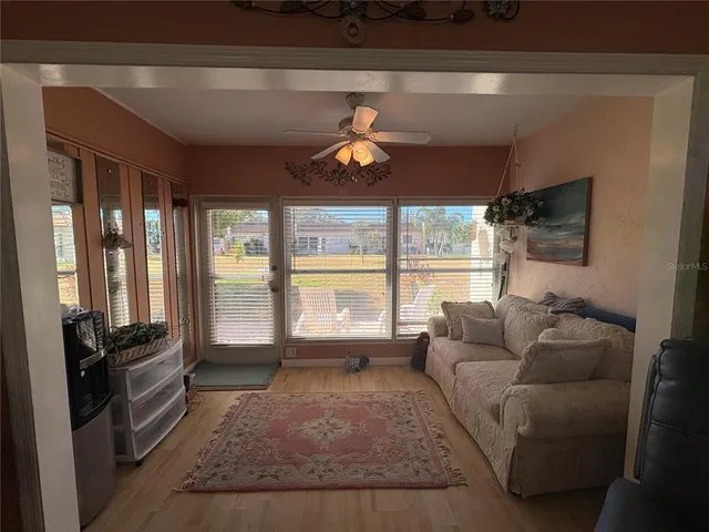a living room with furniture and a window