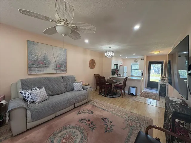 a bedroom with two beds and a flat screen tv