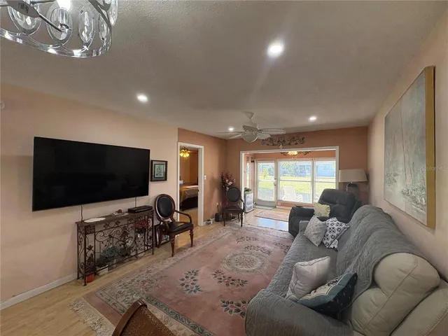 a spacious bathroom with a double vanity sink a toilet and a mirror