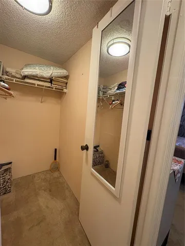 a bed room with a bed and a television