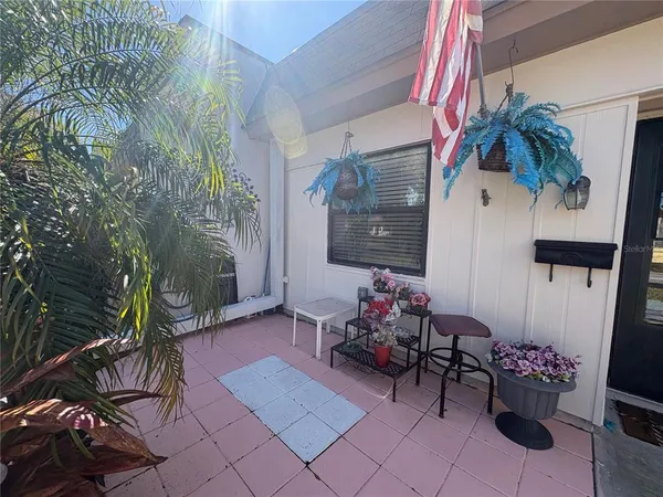 a view of a chairs and table in a patio