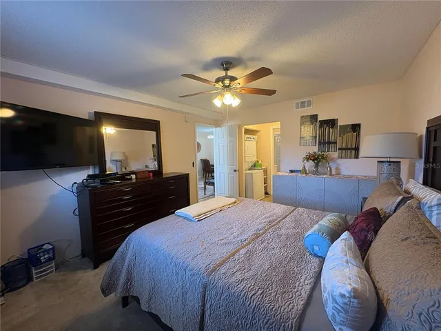 a view of a patio with table and chairs a barbeque with wooden fence
