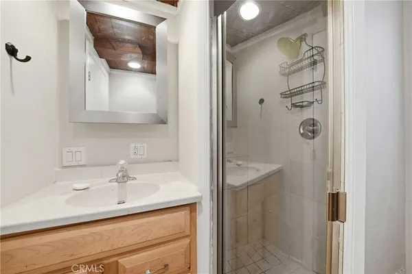 a bathroom with a sink and mirror