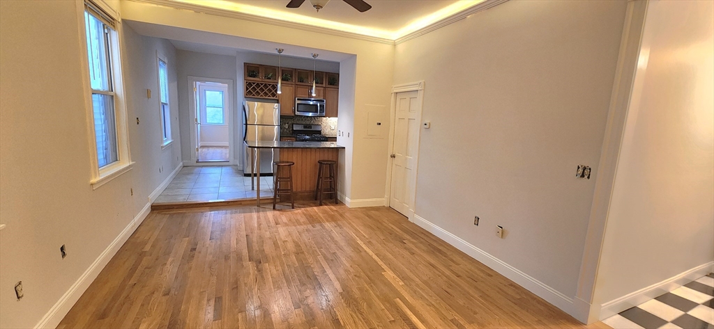 191 Maverick Street, Unit 1L Boston, MA 02128 - Photo 8 of 16 wooden floor in a hall with an entryway
