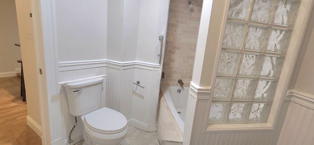 191 Maverick Street, Unit 1L Boston, MA 02128 - Photo 9 of 16 a bathroom with a toilet and a shower
