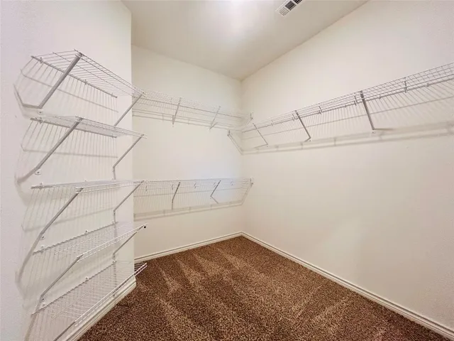 a view of storage and utility room with empty racks
