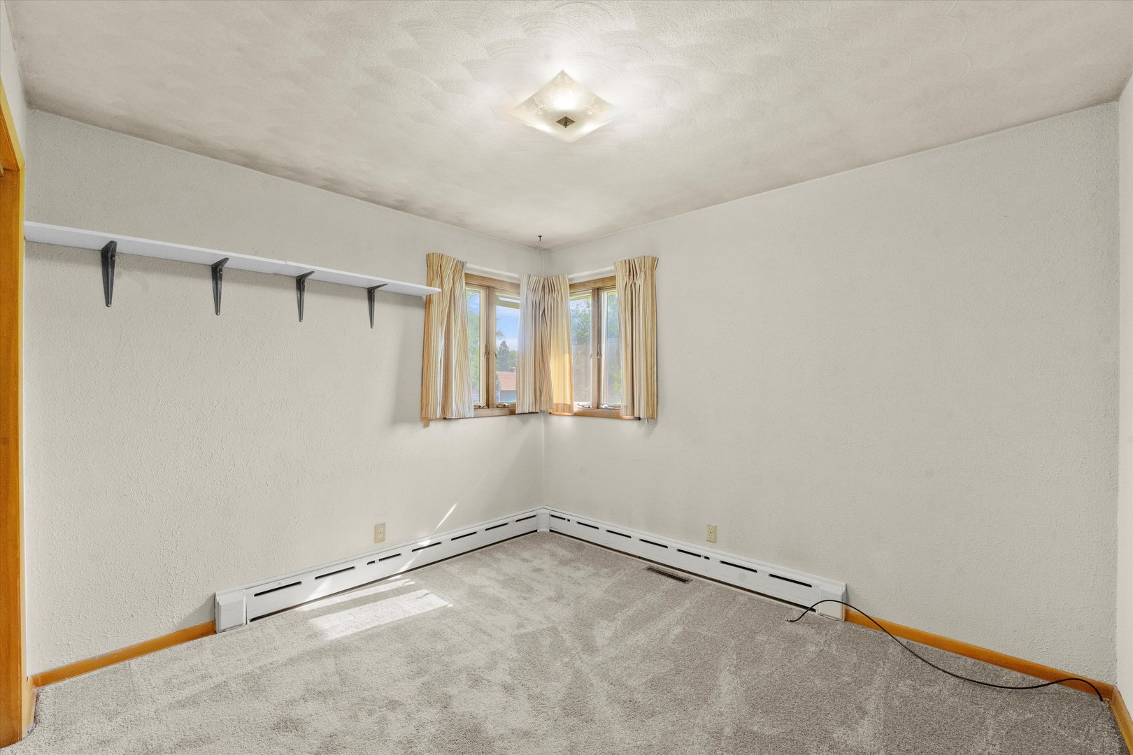 222 Roberts Road New Lenox, IL 60451 - Photo 15 of 24 a view of a room with rack on the wall