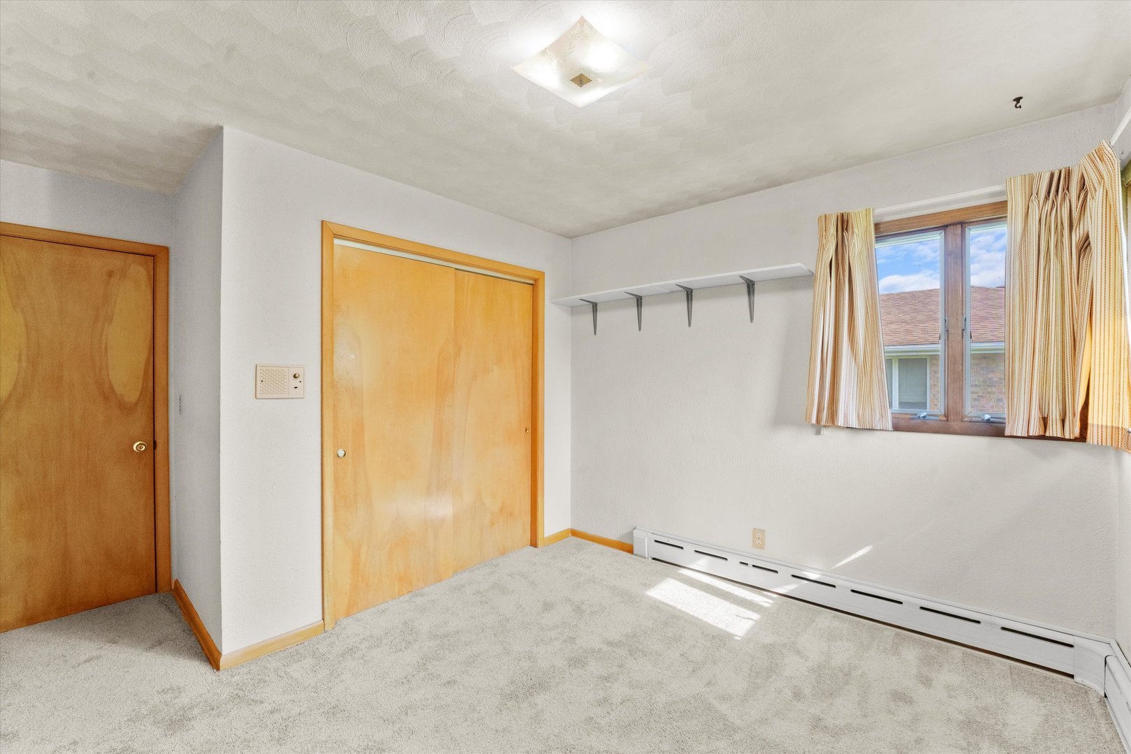 222 Roberts Road New Lenox, IL 60451 - Photo 16 of 24 a view of an empty room with window and closet area