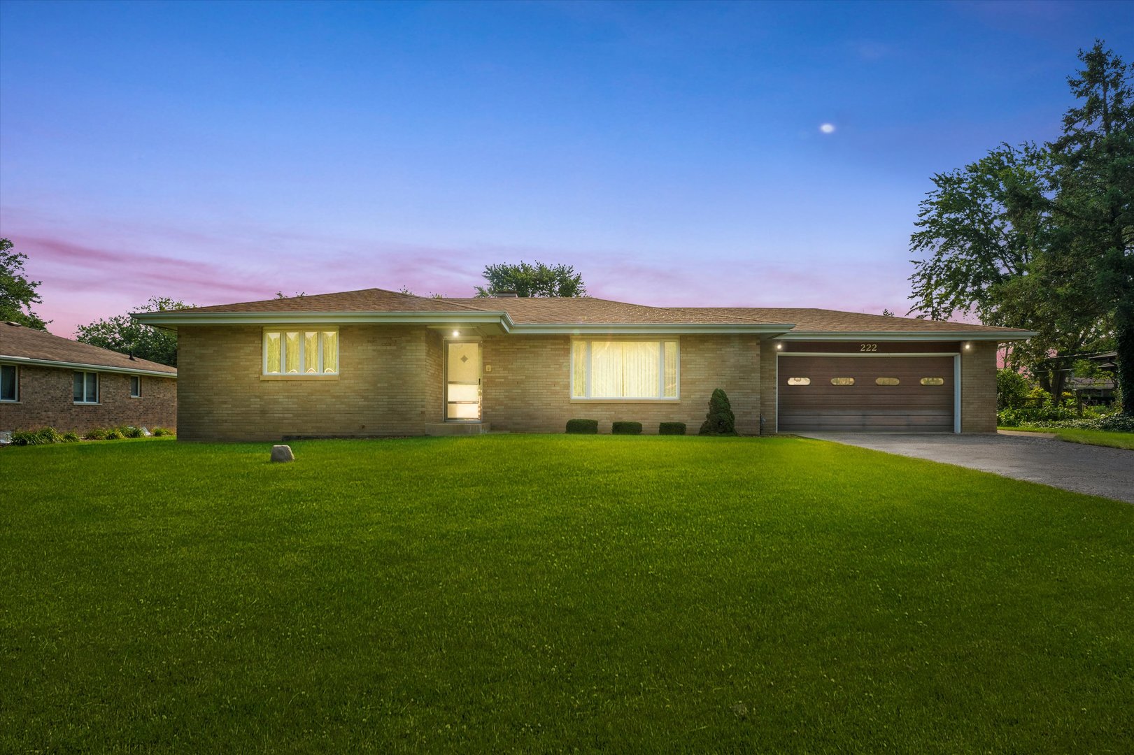 222 Roberts Road New Lenox, IL 60451 - Photo 2 of 24 a front view of a house with a garden and yard