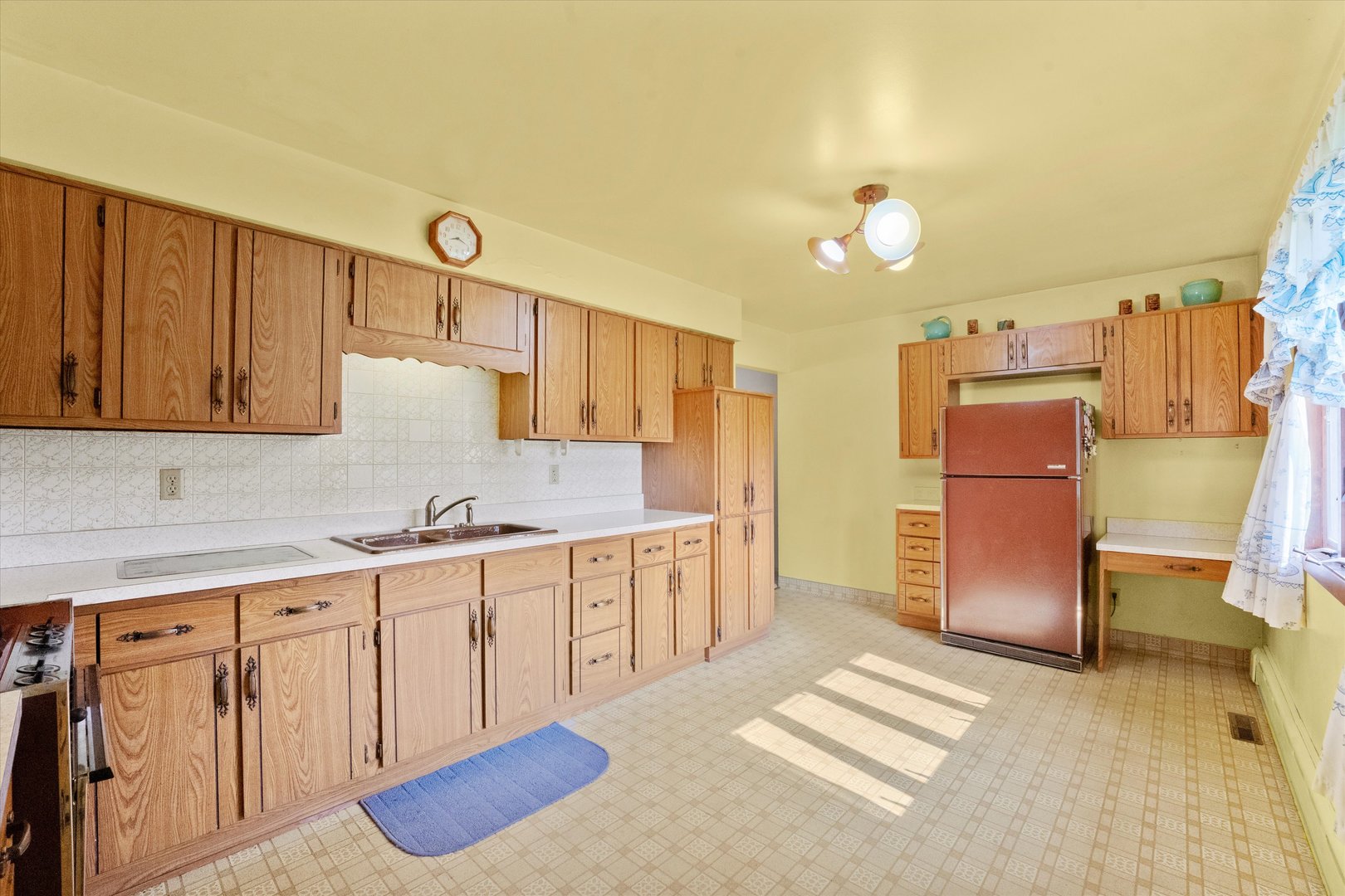 222 Roberts Road New Lenox, IL 60451 - Photo 7 of 24 a kitchen with granite countertop a sink cabinets stainless steel appliances and a counter top space