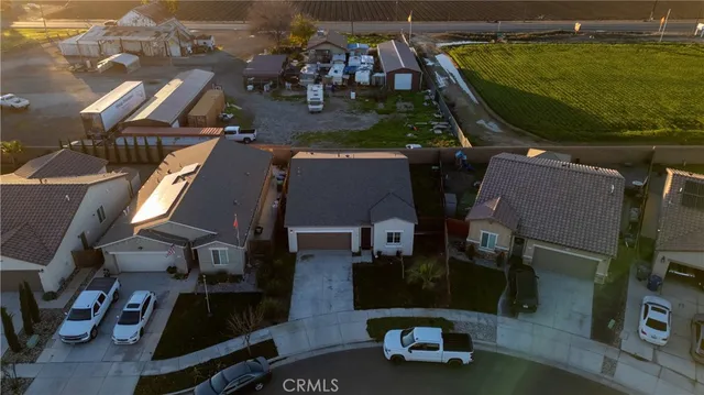 an aerial view of a house with a ocean view