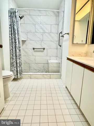 a view of a water fountain and a bench