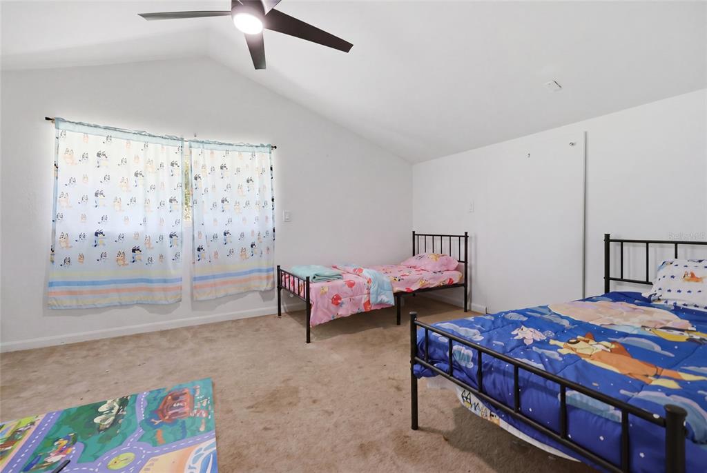 401 Southeast Falcon Road Branford, FL 32008 - Photo 39 of 76 a bedroom with a bed and a table in it