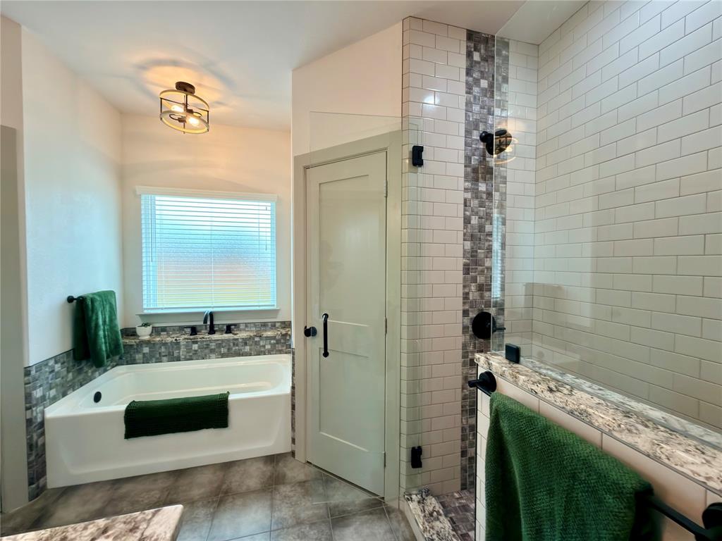 2232 Samuel Street Mabank, TX 75147 - Photo 15 of 36 a bathroom with a sink a toilet and shower