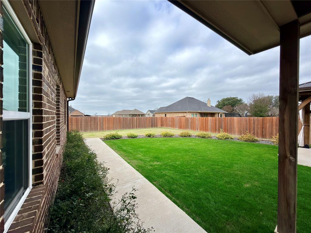 2232 Samuel Street Mabank, TX 75147 - Photo 25 of 36 a view of a garden with a pathway