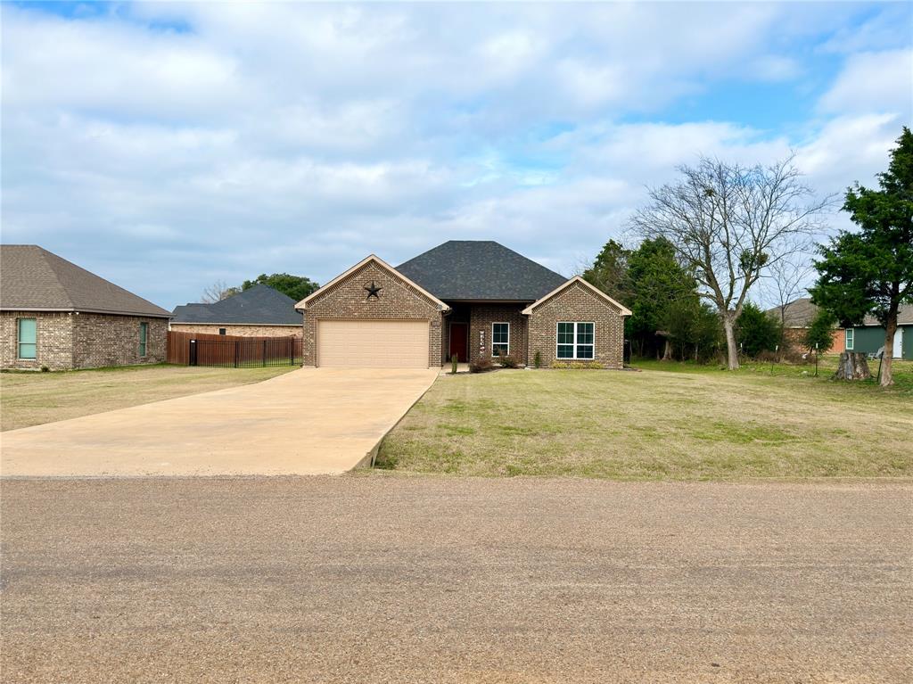 2232 Samuel Street Mabank, TX 75147 - Photo 33 of 36 a house with yard in front of it