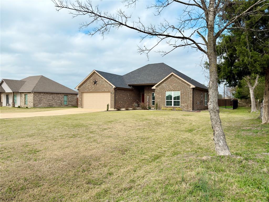 2232 Samuel Street Mabank, TX 75147 - Photo 36 of 36 a house with trees in the background