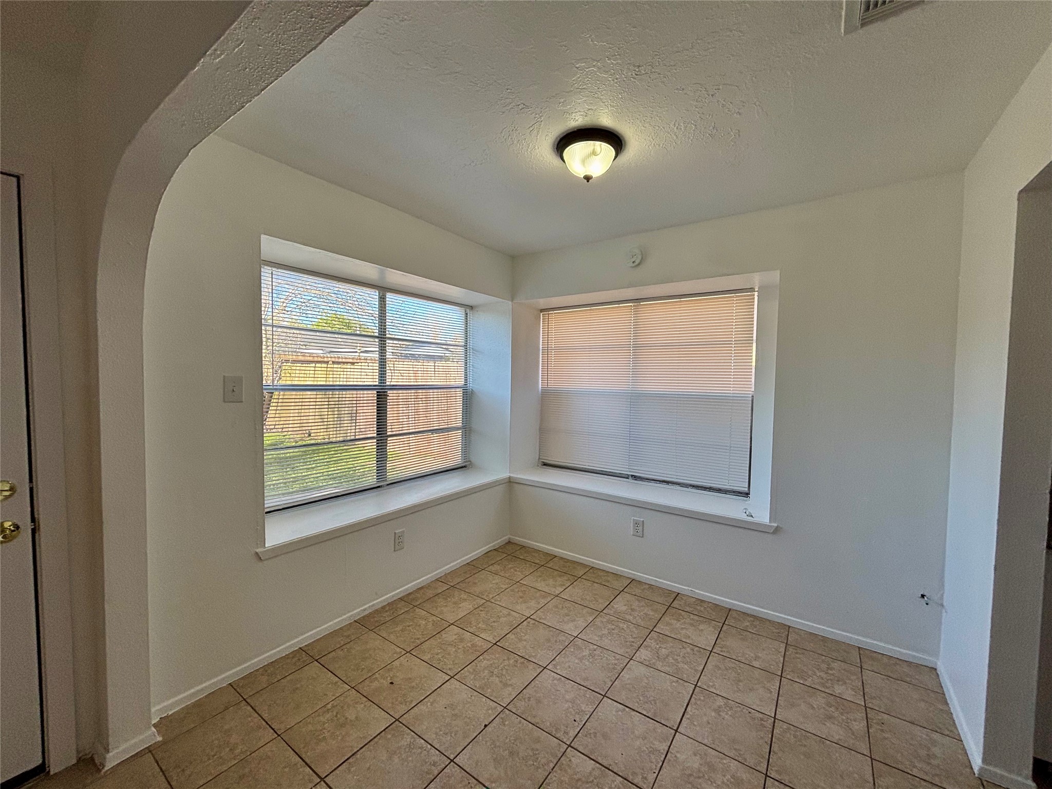 4903 Raven Ridge Drive Houston, TX 77053 - Photo 15 of 20 an empty room with windows