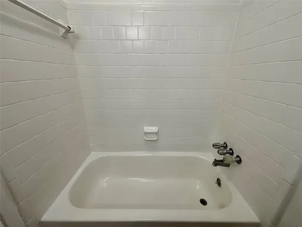 a close up of a bathtub in a bathroom