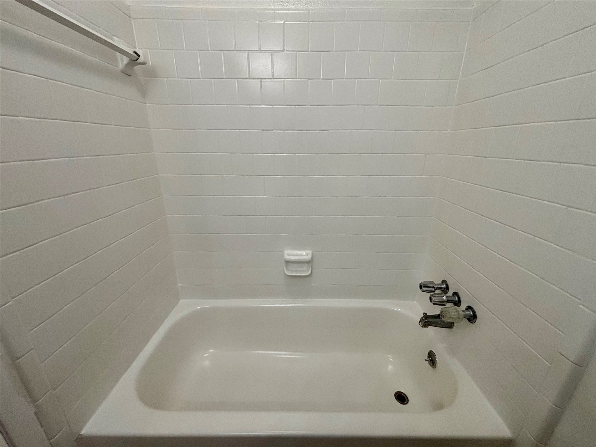 4903 Raven Ridge Drive Houston, TX 77053 - Photo 7 of 20 a close up of a bathtub in a bathroom