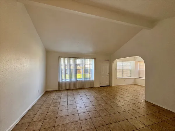 a view of an empty room and window
