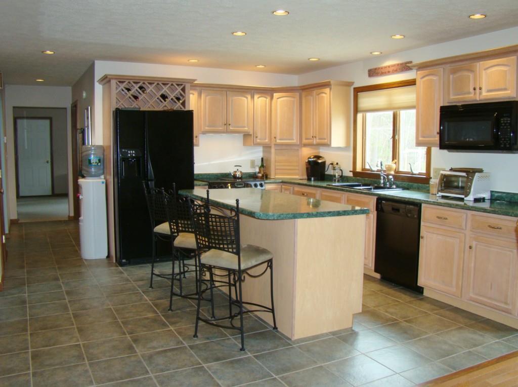 42 Saunders Road Greene, ME 04236 - Photo 10 of 35 Light kitchen cabinetry highlighted...