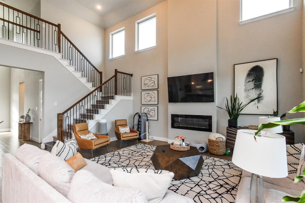 2516 Maidenhair Road Frisco, TX 75033 - Photo 6 of 30 a living room with furniture and a flat screen tv