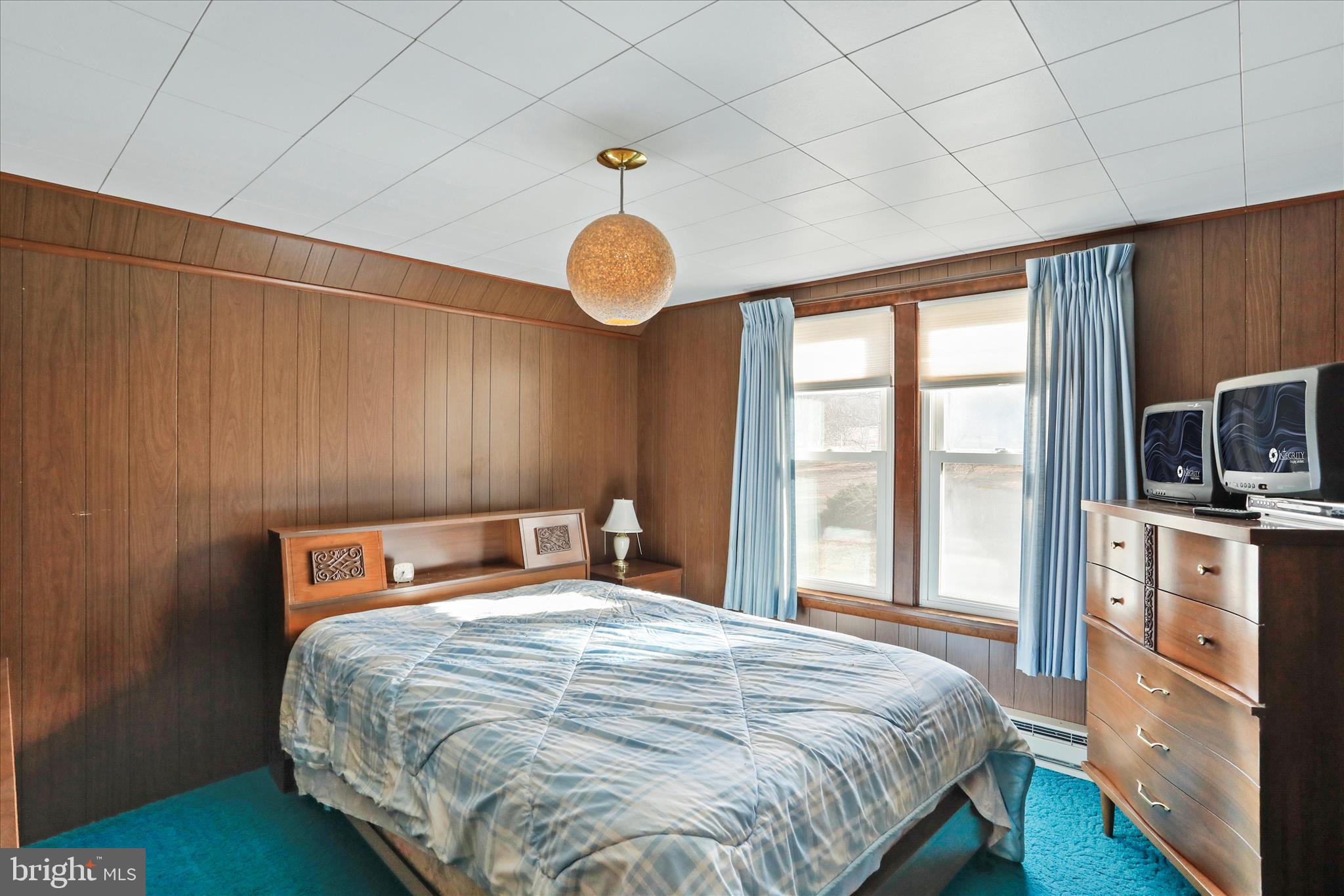 14111 Green Ridge Road Northeast Flintstone, MD 21530 - Photo 20 of 24 a bedroom with a large bed and a tv