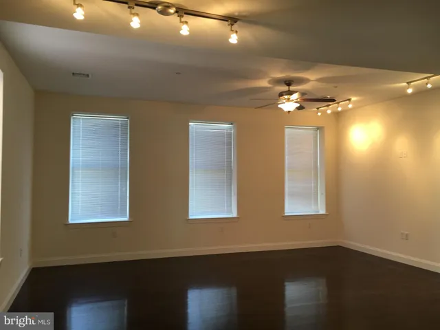 a view of kitchen with furniture and wooden floor