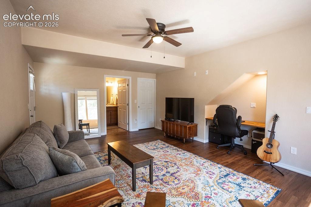 45 Valley Circle Divide, CO 80814 - Photo 22 of 42 a living room with furniture a rug and a flat screen tv
