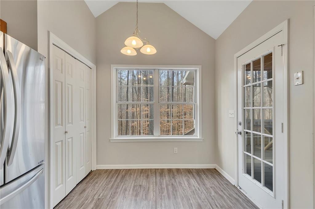 6326 Autumn View Way Northwest Acworth, GA 30101 - Photo 11 of 37 an empty room with wooden floor and windows
