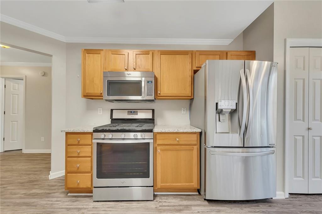6326 Autumn View Way Northwest Acworth, GA 30101 - Photo 14 of 37 a kitchen with a refrigerator and a stove top oven