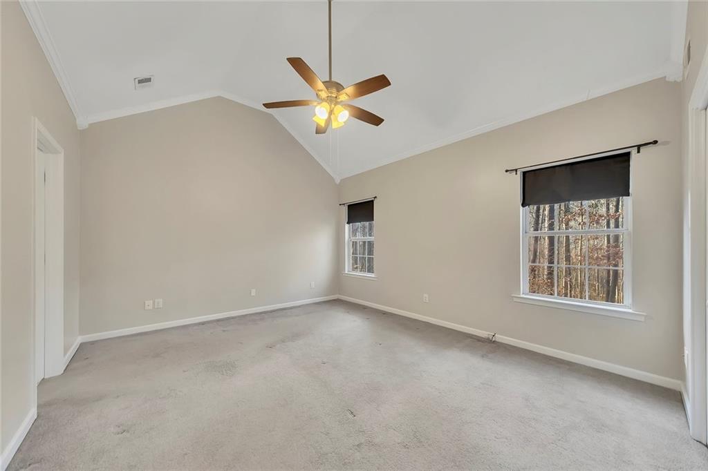 6326 Autumn View Way Northwest Acworth, GA 30101 - Photo 16 of 37 an empty room with windows and fan