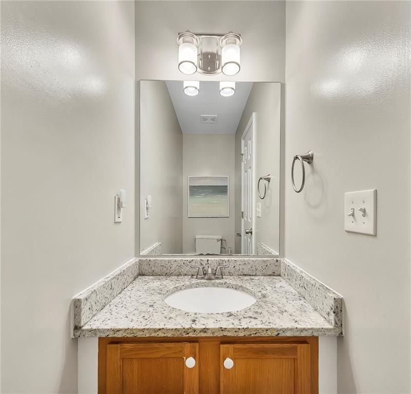 6326 Autumn View Way Northwest Acworth, GA 30101 - Photo 22 of 37 a bathroom with a granite countertop sink and a mirror