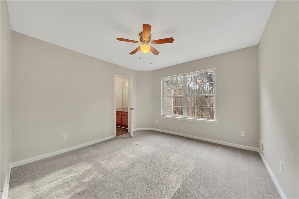6326 Autumn View Way Northwest Acworth, GA 30101 - Photo 23 of 37 a view of room with a ceiling fan and window