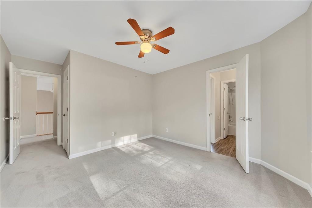 6326 Autumn View Way Northwest Acworth, GA 30101 - Photo 24 of 37 a view of a livingroom with a ceiling fan and window