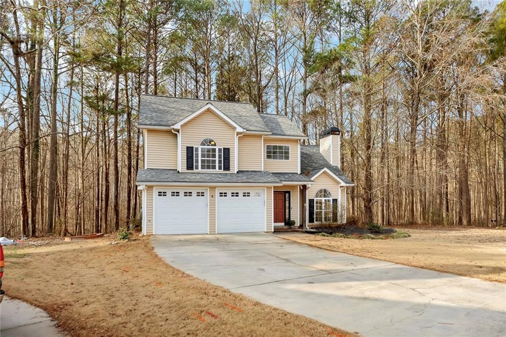6326 Autumn View Way Northwest Acworth, GA 30101 - Photo 3 of 37 a front view of a house with a yard and garage