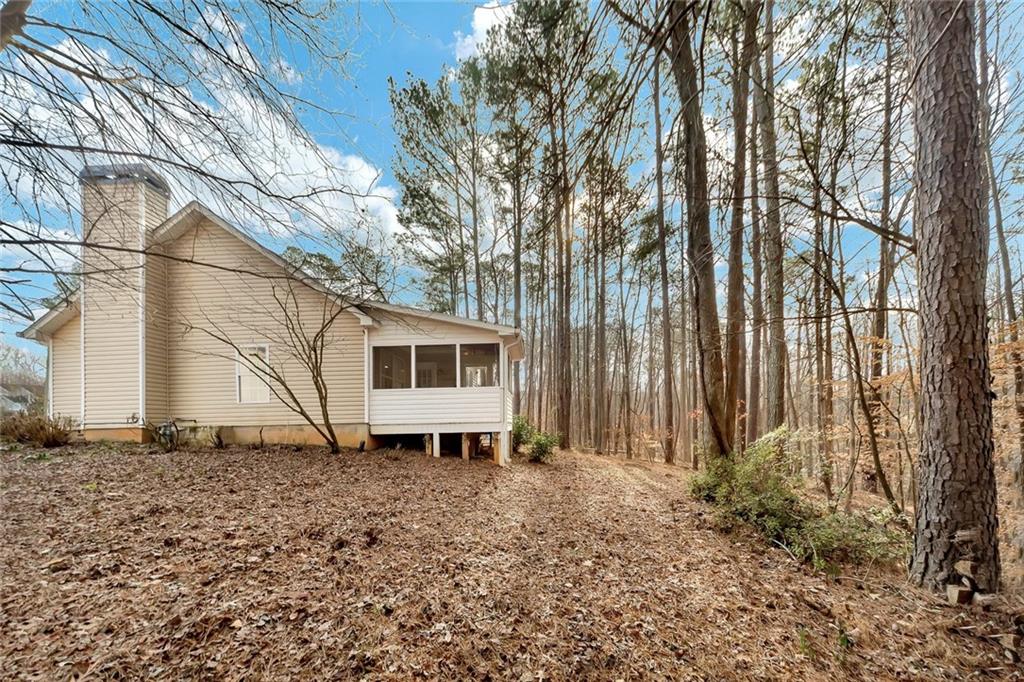 6326 Autumn View Way Northwest Acworth, GA 30101 - Photo 34 of 37 a white house that has a tree in front of it