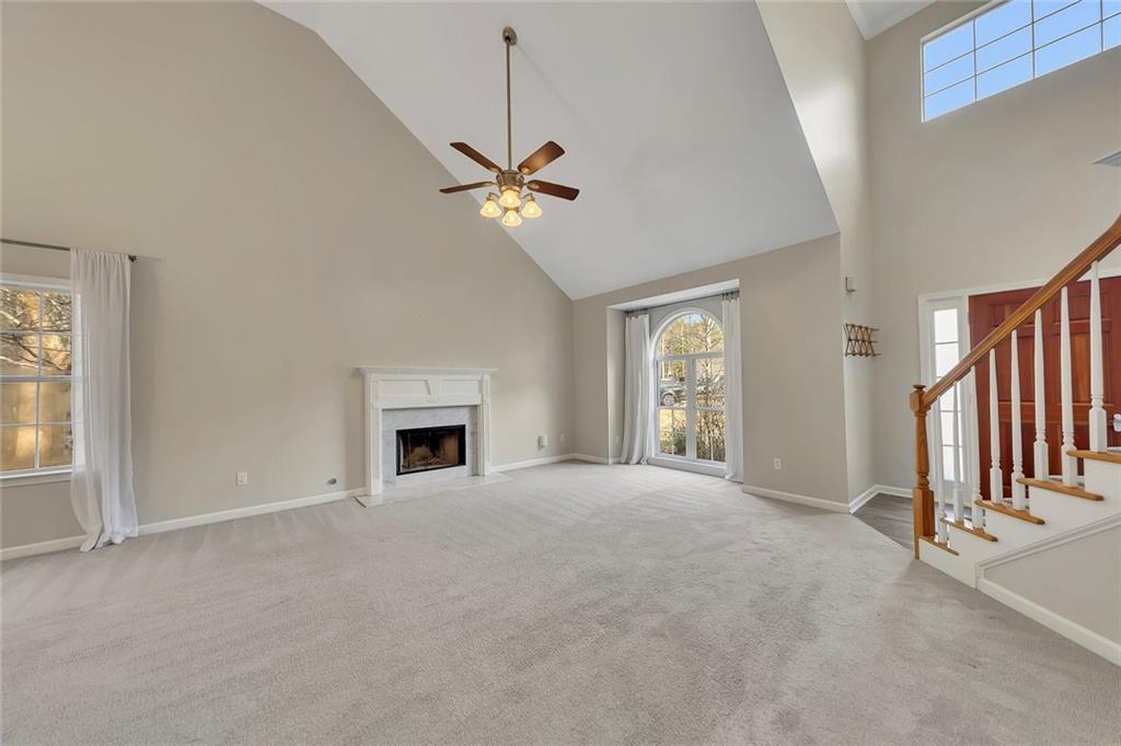 6326 Autumn View Way Northwest Acworth, GA 30101 - Photo 7 of 37 a view of an empty room with a fireplace and a window