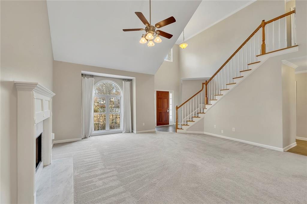 6326 Autumn View Way Northwest Acworth, GA 30101 - Photo 8 of 37 a view of an empty room with a fireplace and a window