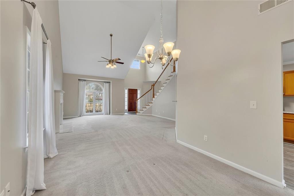 6326 Autumn View Way Northwest Acworth, GA 30101 - Photo 10 of 37 a view of a chandelier fan and windows