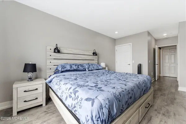 a bedroom with a bed and a view of bathroom