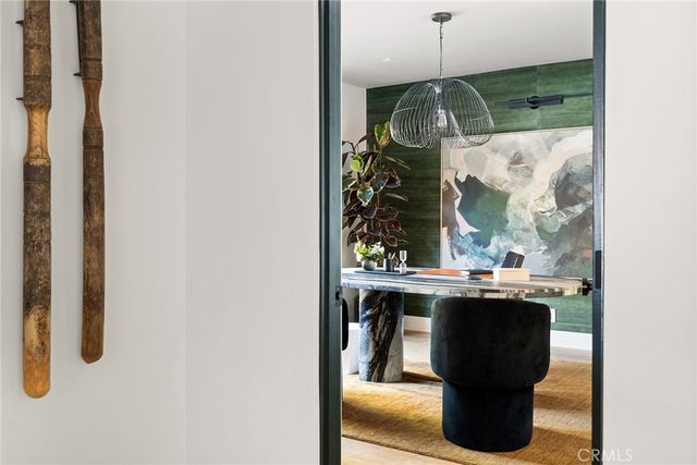 a view of a dining room with furniture and window