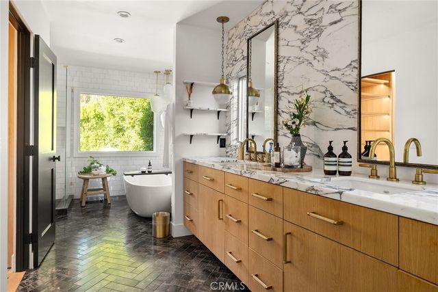 a bedroom with a bed and a mirror