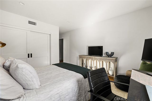 a bathroom with a toilet and a shower curtain