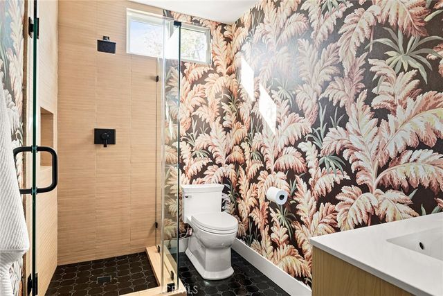 a utility room with sink dryer and washer