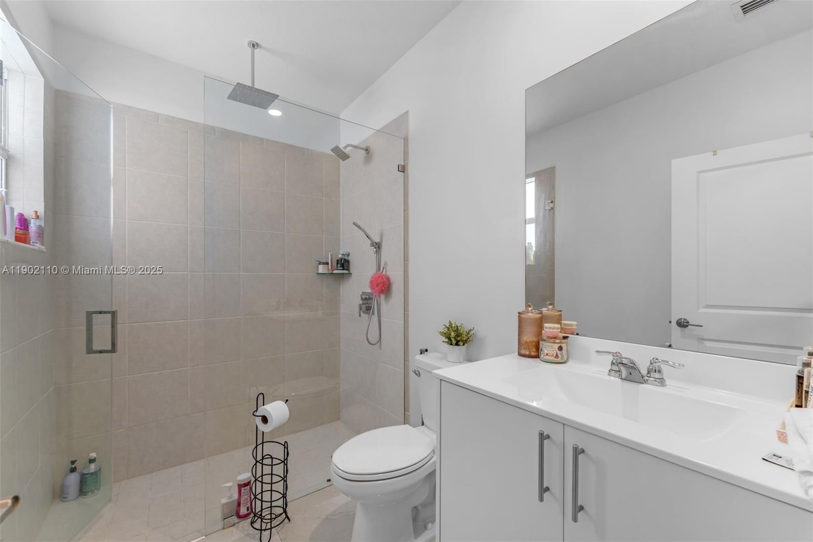 19866 Southwest 320th Street Homestead, FL 33030 - Photo 19 of 55 a bathroom with a sink toilet and shower