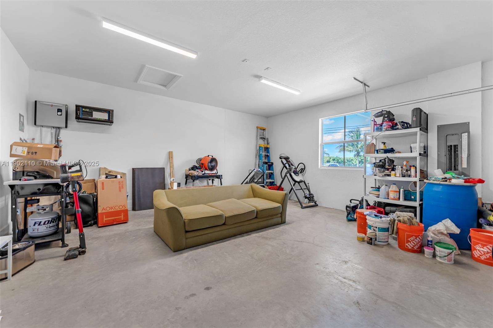 19866 Southwest 320th Street Homestead, FL 33030 - Photo 27 of 55 a bed room with furniture and a gym machine