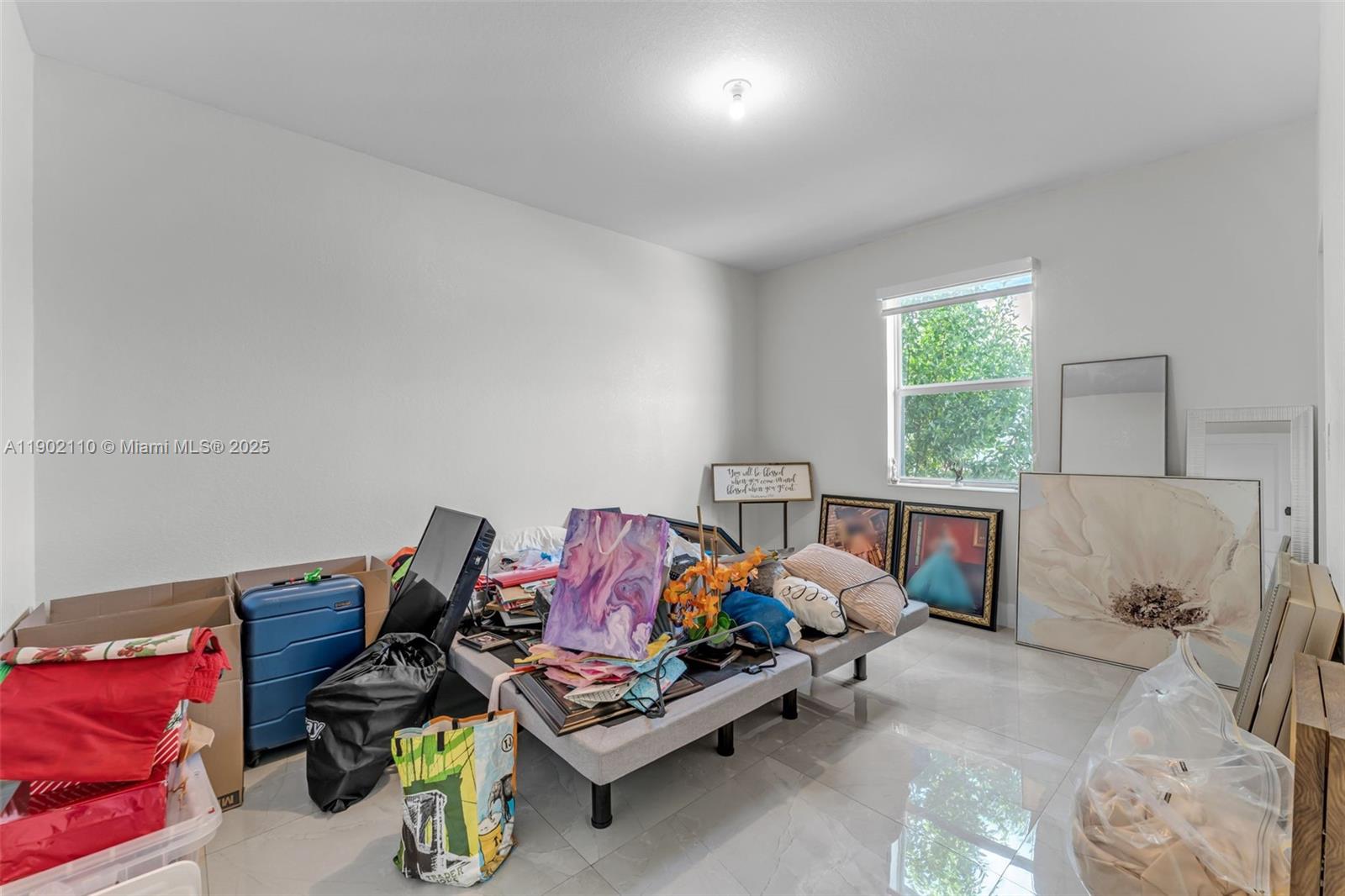 19866 Southwest 320th Street Homestead, FL 33030 - Photo 32 of 55 a bedroom with furniture and a window